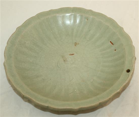 A Chinese Longquan celadon dish and a Ming dynasty lotus bowl, 15th / 16th century, diam. 15cm